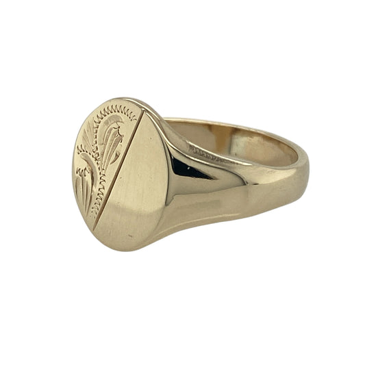 Bring classic style and bold presence to your collection with this pre-owned 9ct yellow gold patterned oval signet ring—a timeless piece with strong character.

Design: The ring features a 14mm high oval front with an engraved patterned finish, giving the traditional signet style added depth and detail.
Material: Made from 9-carat yellow gold, the polished surface highlights the engraved texture and warm golden tones.