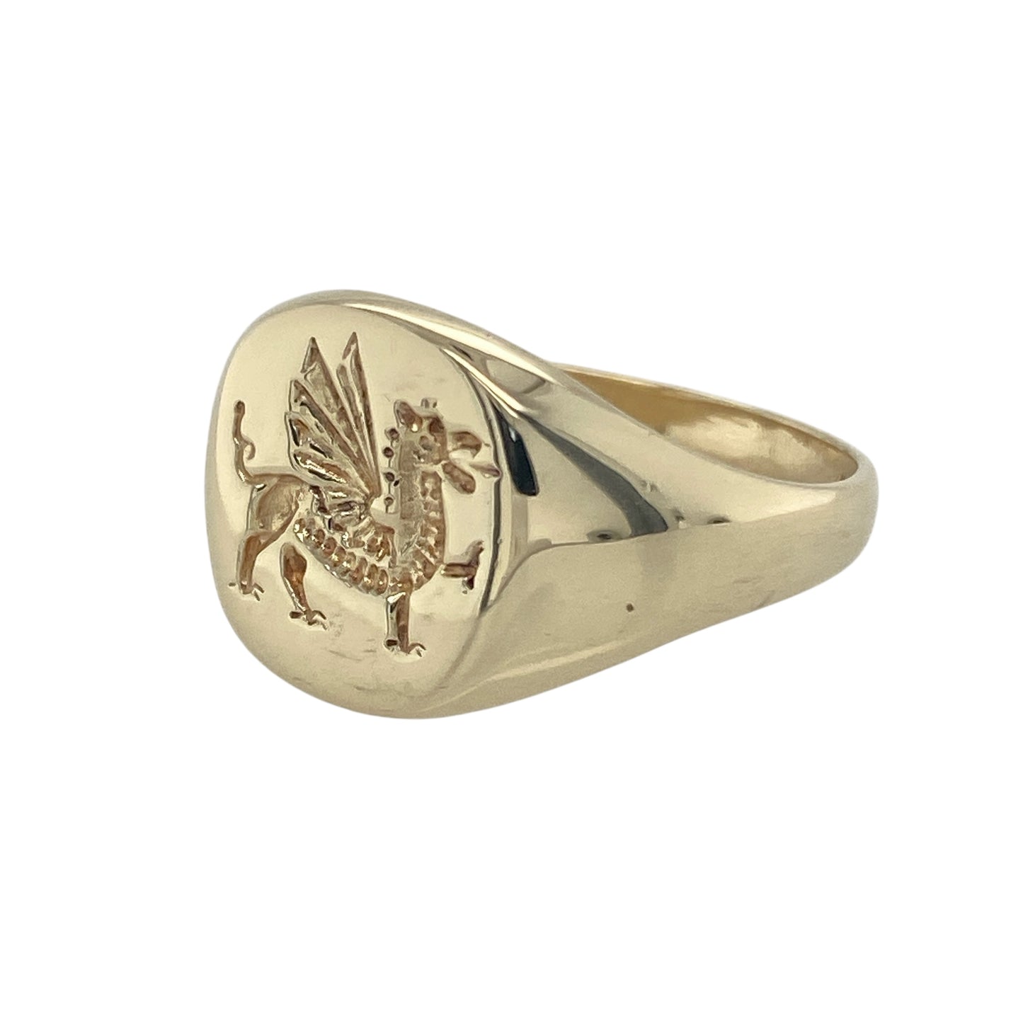Bring heritage pride and classic style to your collection with this pre-owned 9ct yellow gold Welsh Dragon signet ring—a bold design symbolising strength and tradition.

Design: The ring features a 13mm high round front engraved with the iconic Welsh Dragon, representing courage, power, and national pride.
Material: Made from 9-carat yellow gold, the polished finish enhances the engraved detail and rich golden tones.
