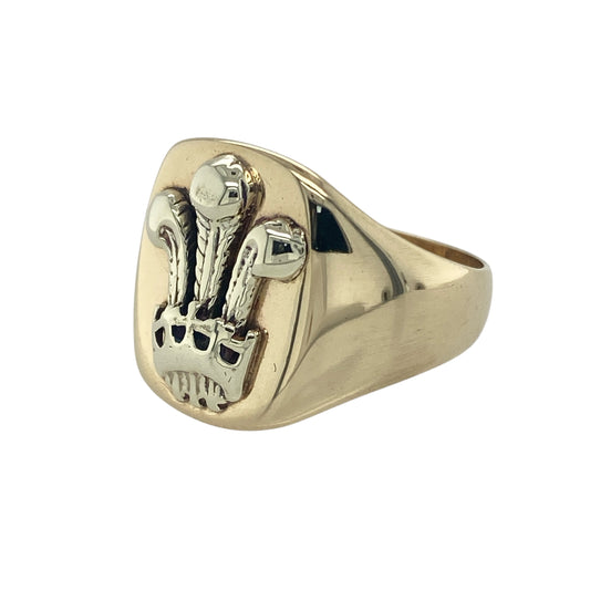 Bring heritage symbolism and bold style to your collection with this pre-owned 9ct yellow and white gold Welsh Three Feathers signet ring—a meaningful design representing pride and tradition.

Design: The ring features a 17mm high front engraved with the Welsh Three Feathers emblem, highlighted with white gold detailing for contrast and definition.
Material: Made from 9-carat yellow and white gold, the polished finish enhances both the intricate engraving and the two-tone design.
