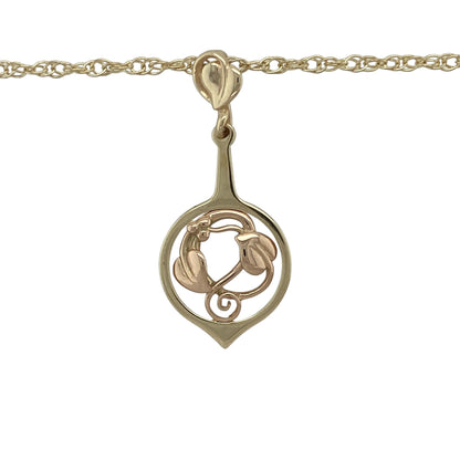 Bring symbolic beauty and timeless detail to your collection with this pre-owned Clogau Tree of Life pendant in 9ct yellow and rose gold, paired with an 18-inch Prince of Wales chain for a classic finish.

Design: The pendant measures 3.8cm long and features the iconic Tree of Life motif, symbolising growth, renewal, and harmony, accented with rose gold detailing for contrast.
Material: Made from 9-carat yellow and rose gold, the polished surface highlights the intricate two-tone design.