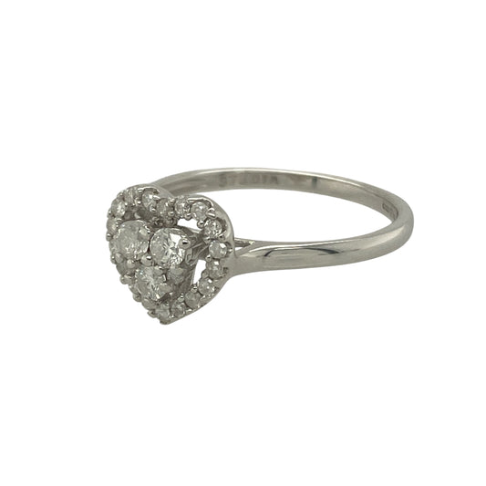 Bring romantic sparkle and timeless charm to your collection with this pre-owned 9ct white gold diamond heart cluster ring, a delicate design full of elegance and sentiment.

Design: The ring features a cluster of brilliant-cut diamonds arranged into a classic heart shape, creating a dazzling and symbolic centrepiece.
Material: Made from 9-carat white gold, the polished band enhances the brilliance of the diamonds and complements the romantic design.
