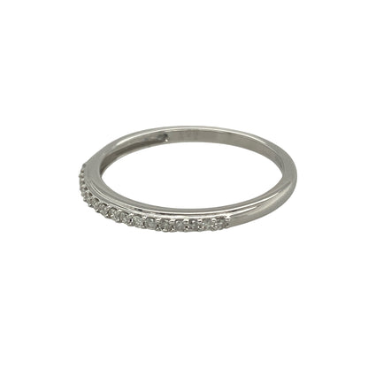 Bring subtle sparkle and refined elegance to your collection with this pre-owned 9ct white gold diamond band ring, a versatile piece perfect for everyday wear or special occasions.

Design: The ring features a 2mm wide band with approximately 0.12ct of brilliant-cut diamonds set across the surface, adding a touch of understated radiance.
Material: Made from 9-carat white gold, the polished finish enhances the diamonds’ natural brilliance while offering a sleek and modern look.