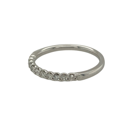 Bring elegant sparkle and timeless style to your collection with this pre-owned 9ct white gold diamond band ring, a refined design suited to both everyday wear and special occasions.

Design: The ring features a 2mm wide band set with approximately 0.20ct of brilliant-cut diamonds, offering radiant sparkle in a sleek and understated style.
Material: Made from 9-carat white gold, the polished finish beautifully complements the diamonds and adds a modern, sophisticated touch.