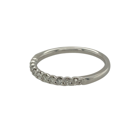 Bring elegant sparkle and timeless style to your collection with this pre-owned 9ct white gold diamond band ring, a refined design suited to both everyday wear and special occasions.

Design: The ring features a 2mm wide band set with approximately 0.20ct of brilliant-cut diamonds, offering radiant sparkle in a sleek and understated style.
Material: Made from 9-carat white gold, the polished finish beautifully complements the diamonds and adds a modern, sophisticated touch.