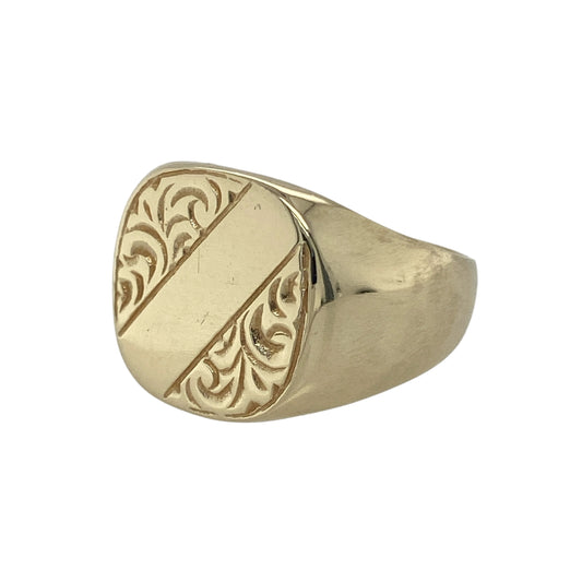 Bring bold style and distinctive detail to your collection with this pre-owned 9ct yellow gold patterned square signet ring, a striking piece with classic character.

Design: The ring features a 15mm high square front with a patterned finish, giving it a unique and eye-catching look.
Material: Made from 9-carat yellow gold, the polished surfaces complement the patterned detail and add warmth to the design.
