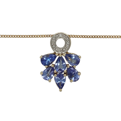 Bring vibrant colour and refined sparkle to your collection with this pre-owned 9ct yellow gold diamond and tanzanite pendant on a 20" curb chain, a striking design with elegant detail.

Design: The pendant measures 2.1cm long and features a diamond-set circle at the top, from which multiple tanzanite stones flow beneath, creating a graceful and eye-catching look.