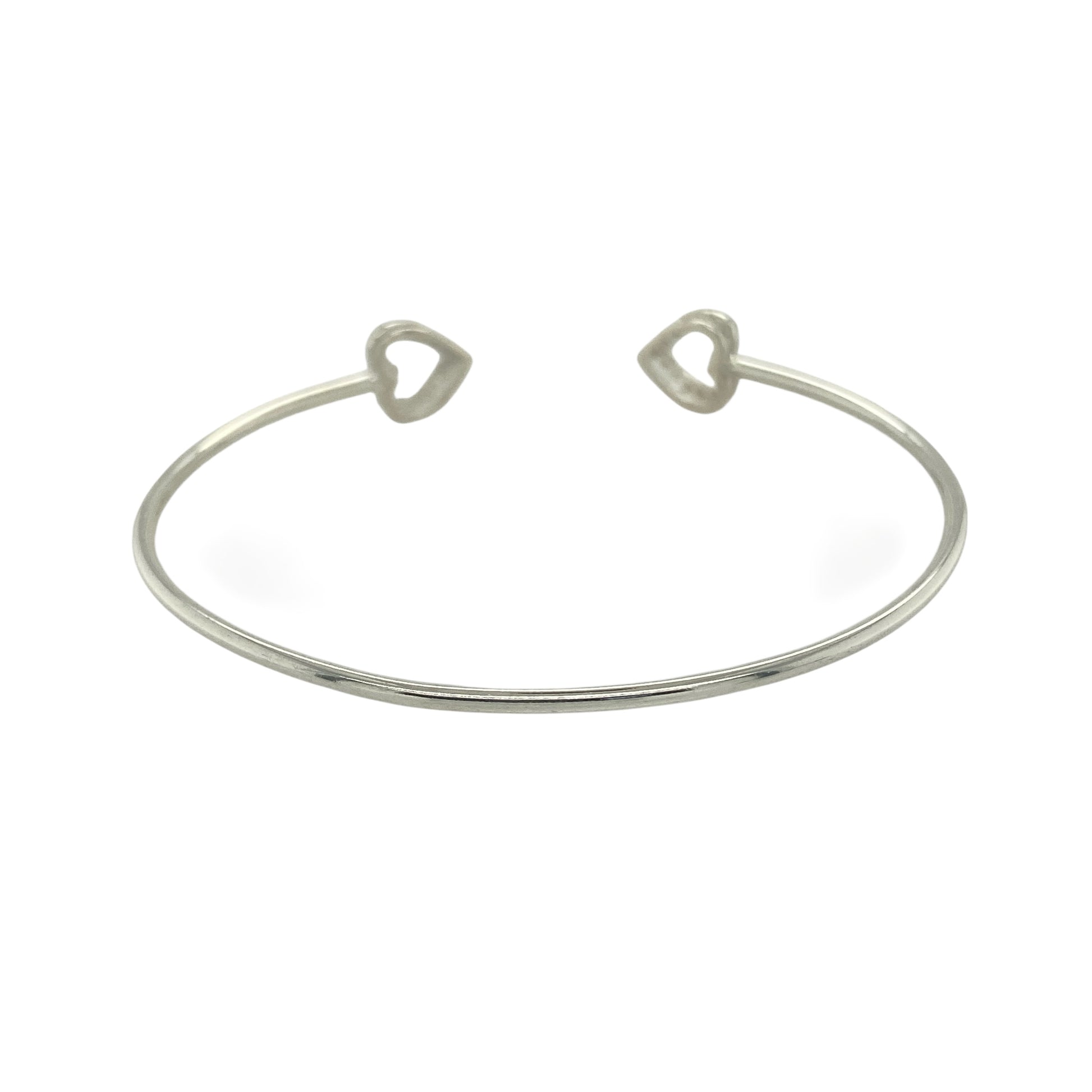 Bring modern sparkle and elegant charm to your collection with this new 925 silver cubic zirconia open heart torque bangle, a stylish design perfect for any occasion.

Design: The bangle features an open torque style with a delicate heart at one end, accented with sparkling cubic zirconia stones for a refined finish.
Material: Made from solid 925 sterling silver, the polished surface enhances the shine and brilliance of the cubic zirconia accents.