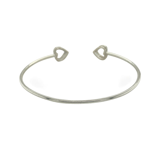Bring modern sparkle and elegant charm to your collection with this new 925 silver cubic zirconia open heart torque bangle, a stylish design perfect for any occasion.

Design: The bangle features an open torque style with a delicate heart at one end, accented with sparkling cubic zirconia stones for a refined finish.
Material: Made from solid 925 sterling silver, the polished surface enhances the shine and brilliance of the cubic zirconia accents.