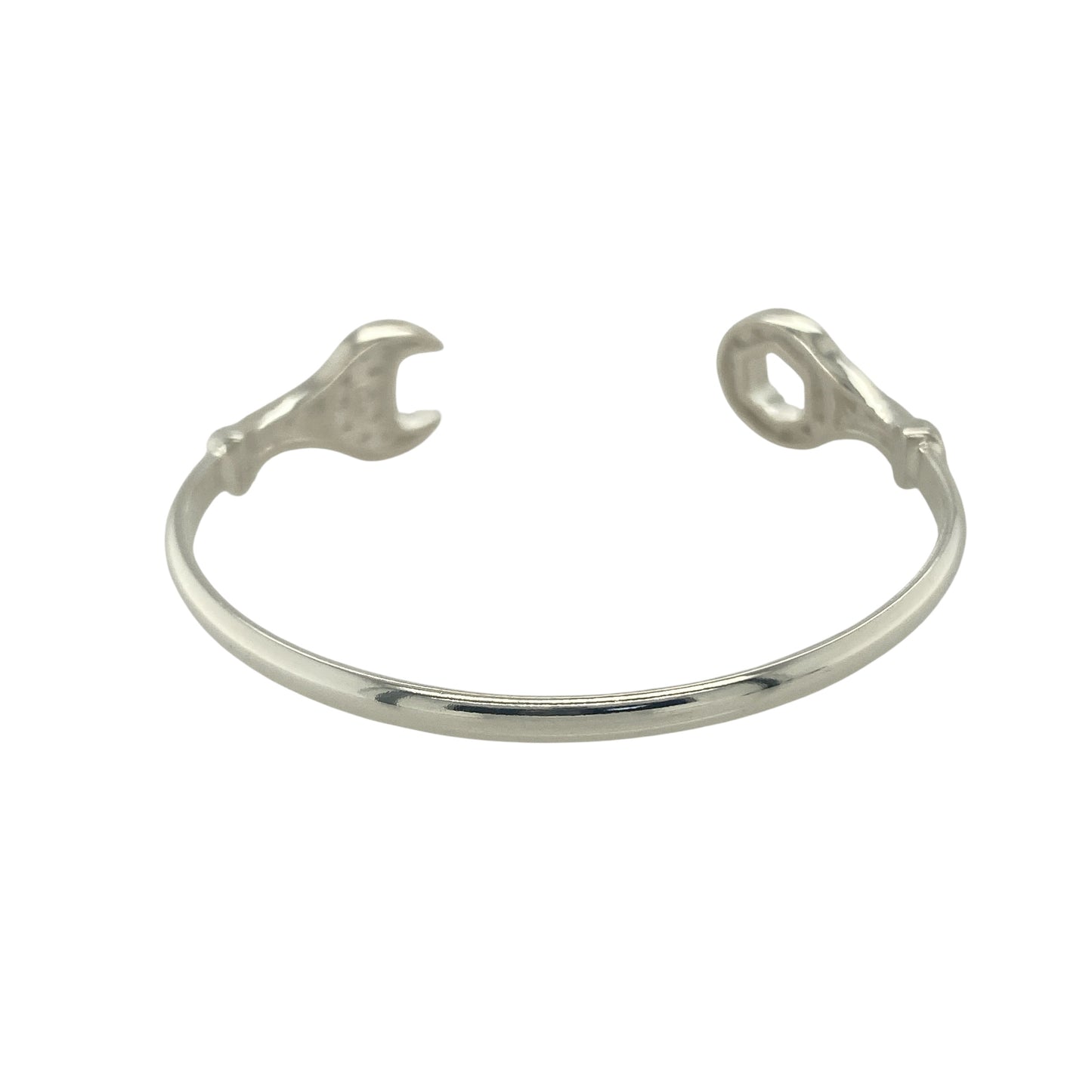 Bring playful style and sparkling detail to your collection with this new 925 silver cubic zirconia spanner torque bangle, a fun and fashionable design for children.

Design: The bangle features a torque style with a spanner-inspired design at the ends, accented with sparkling cubic zirconia stones for a touch of brilliance.
Material: Made from solid 925 sterling silver, the polished finish enhances the shine and gives a modern look.