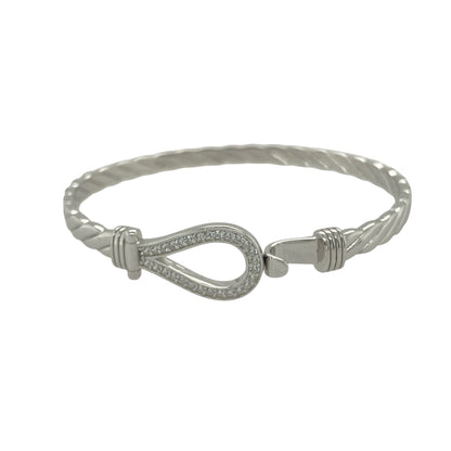 Bring charm and sparkle to your collection with this new 925 silver cubic zirconia children’s horseshoe bangle, a delightful design symbolising luck and happiness.

Design: The bangle features an 11mm high front with a classic horseshoe motif, accented with sparkling cubic zirconia stones for a bright and elegant finish.
Material: Made from solid 925 sterling silver, the polished surface enhances the shine and adds a sleek, refined look.