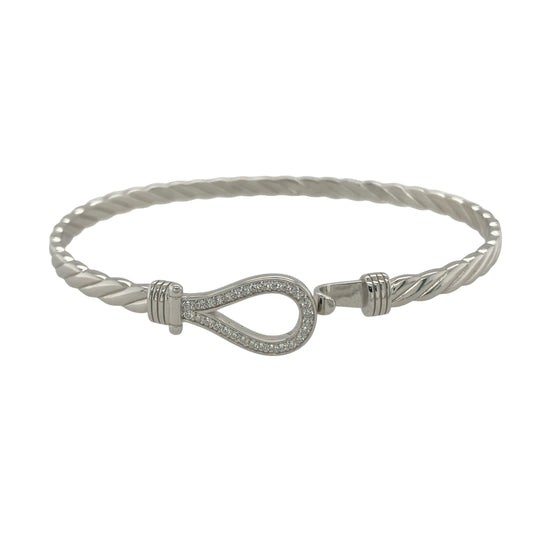 Bring elegant sparkle and timeless charm to your collection with this new 925 silver cubic zirconia horseshoe bangle, a classic design symbolising luck and positivity.

Design: The bangle features an 11mm high front with a beautifully detailed horseshoe motif, accented with sparkling cubic zirconia stones for a refined and radiant look.
Material: Made from solid 925 sterling silver, the polished finish enhances the brilliance of the stones and gives the piece a sleek, sophisticated appearance.