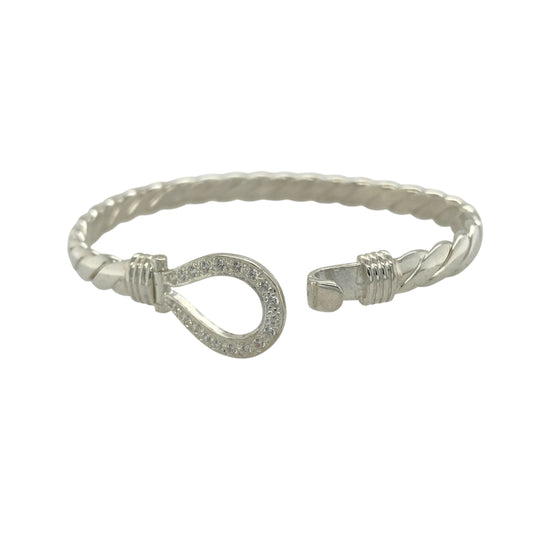 Bring timeless elegance and refined sparkle to your collection with this new 925 silver cubic zirconia horseshoe bangle, a beautifully crafted piece symbolising luck and protection.

Design: The bangle features a 15mm high front with a classic horseshoe motif, accented with sparkling cubic zirconia stones and set on a solid twisted silver band for a striking, elegant finish.