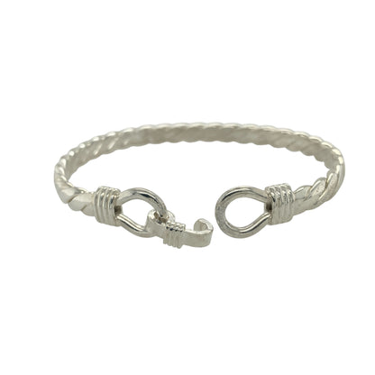 Bring bold elegance and timeless symbolism to your collection with this new solid 925 silver double horseshoe twisted bangle, a beautifully designed piece representing luck and strength.

Design: The bangle features a 12mm high front with two interlocking horseshoes, set on a solid twisted silver band for a stylish and distinctive finish.
Material: Made from solid 925 sterling silver, the polished surface highlights the craftsmanship of the twisted design and adds sleek shine.