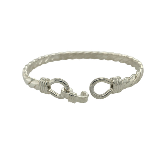 Bring bold elegance and timeless symbolism to your collection with this new solid 925 silver double horseshoe twisted bangle, a beautifully designed piece representing luck and strength.

Design: The bangle features a 12mm high front with two interlocking horseshoes, set on a solid twisted silver band for a stylish and distinctive finish.
Material: Made from solid 925 sterling silver, the polished surface highlights the craftsmanship of the twisted design and adds sleek shine.