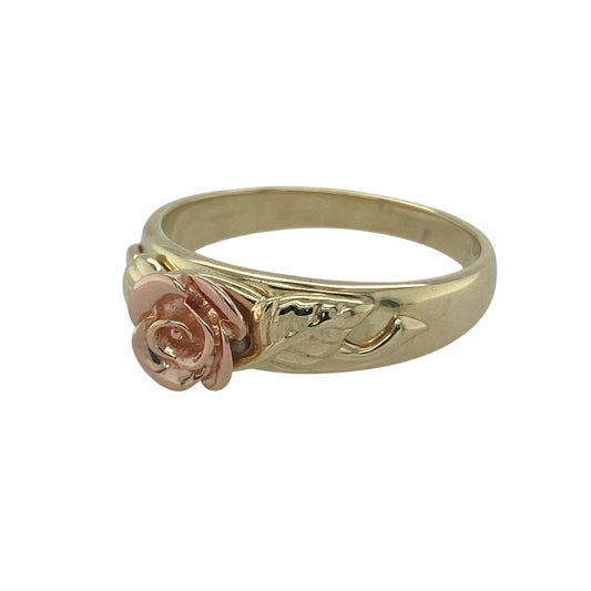 Bring romantic charm and timeless elegance to your collection with this pre-owned 9ct yellow and rose gold Clogau Rose Flower ring—a graceful design inspired by natural beauty and Welsh heritage.

Design: The ring showcases a detailed rose flower motif in warm rose gold, framed by yellow gold shoulders for a beautifully balanced two-tone look. The floral design symbolises love, beauty, and renewal, capturing Clogau’s signature craftsmanship and charm.