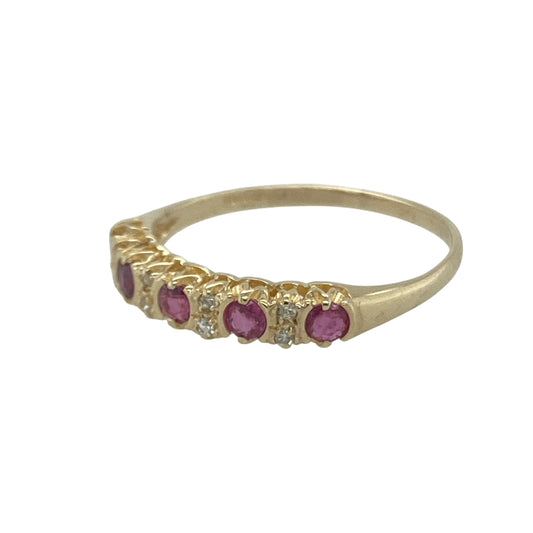 Bring classic elegance and vibrant colour to your collection with this pre-owned 9ct yellow gold diamond and ruby band ring—a timeless design that beautifully balances sparkle and warmth.

Design: The ring features alternating round-cut rubies and diamonds across the front, creating a delicate pattern of rich red and bright white tones for a refined and graceful look.