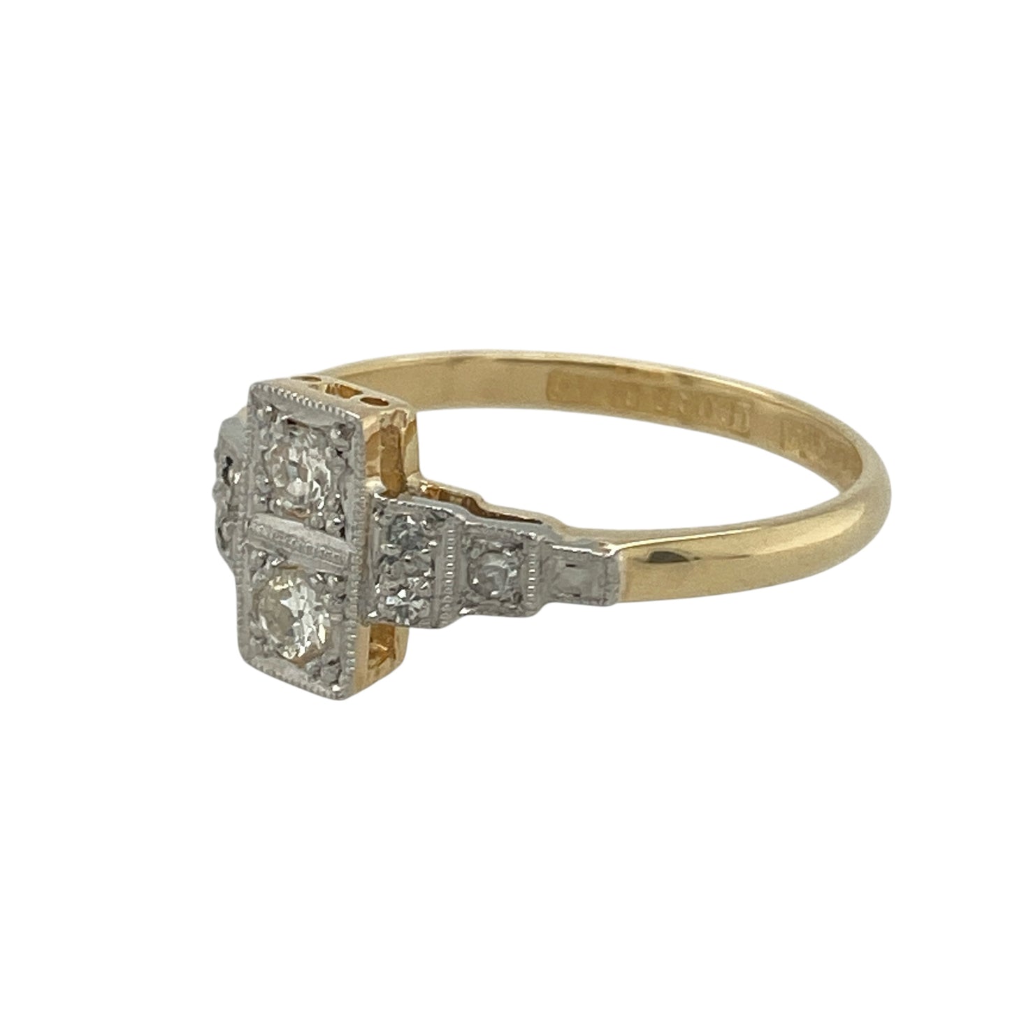 Bring vintage elegance and timeless sophistication to your collection with this pre-owned 18ct yellow gold and platinum diamond Art Deco style ring—a stunning piece inspired by the glamour of a bygone era.

Design: The ring showcases a beautiful vintage-style Art Deco design, featuring geometric detailing and sparkling diamonds arranged with classic symmetry. The contrast between the bright diamonds and the sleek platinum highlights creates a refined and elegant look.