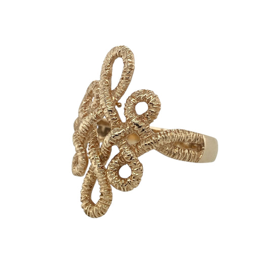Bring bold elegance and distinctive style to your collection with this pre-owned 9ct yellow gold open weave twist dress ring—a striking design that showcases flowing movement and refined craftsmanship.

Design: The ring features an intricate open weave twist pattern across the front, creating a sculptural look with beautiful curves and light-catching detail. Its fluid design offers both texture and dimension, making it a standout statement piece.