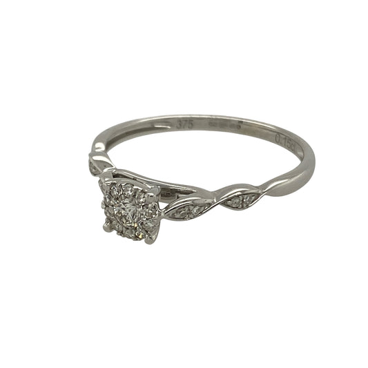 Bring classic sparkle and modern elegance to your collection with this pre-owned 9ct white gold diamond illusion-set solitaire ring—a refined design that combines timeless beauty with contemporary detail.

Design: The ring features an illusion-set diamond centre, giving the appearance of a larger stone and enhancing its brilliance. The diamond, with a total weight of approximately 0.15ct, is complemented by gracefully twisted shoulders that add a stylish and delicate touch.