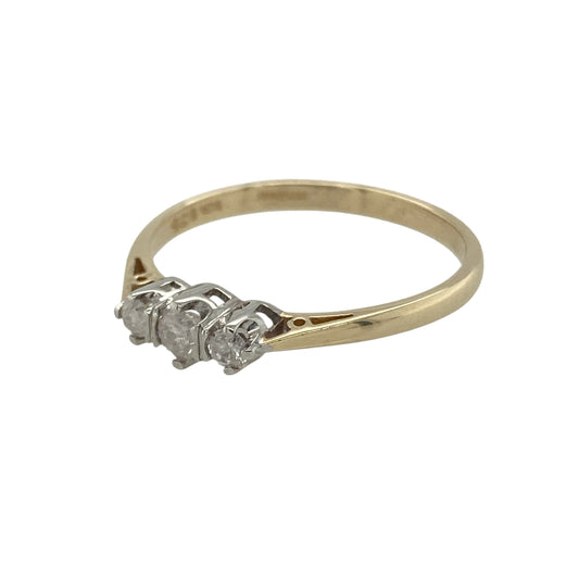 Bring classic sparkle and timeless elegance to your collection with this pre-owned 9ct yellow gold diamond trilogy ring—a refined design symbolising the past, present, and future.

Design: The ring features three brilliant-cut diamonds with a total diamond weight of approximately 0.25ct. The trio of stones represents love through time, while their bright sparkle adds understated sophistication. The diamonds have an approximate clarity of I2, giving the piece natural character and charm.