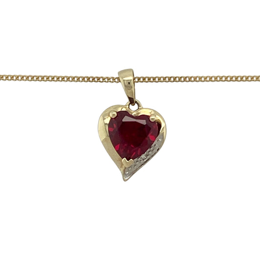 Bring romance, colour, and timeless elegance to your collection with this pre-owned 9ct yellow gold diamond and ruby heart pendant on an 18" curb chain necklace—a beautifully symbolic piece celebrating love and sophistication.

Design: The pendant features a striking 7mm heart-shaped ruby at its centre, radiating rich red tones that symbolise passion and devotion. Sparkling diamonds accent the design, adding brilliance and enhancing the beauty of the central gemstone.