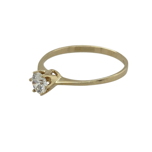 Bring simple elegance and timeless sparkle to your collection with this pre-owned 9ct yellow gold cubic zirconia solitaire ring—a classic design that radiates understated beauty.

Design: The ring features a single 4mm round cubic zirconia stone, offering brilliant sparkle and clarity that beautifully catches the light. The minimalist solitaire design enhances the stone’s brilliance, creating a refined and elegant look.