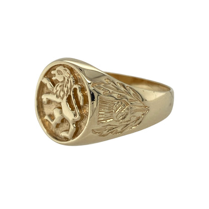 Bring strength, heritage, and bold elegance to your collection with this pre-owned 9ct yellow gold oval lion signet ring—a striking design that combines traditional symbolism with refined craftsmanship.

Design: The ring features an engraved lion motif on the oval-shaped front, symbolising courage and nobility. The detailed thistle engravings on the shoulders add a touch of Scottish heritage and intricate charm. Measuring 15mm high at the front, the ring makes a powerful and distinguished statement.