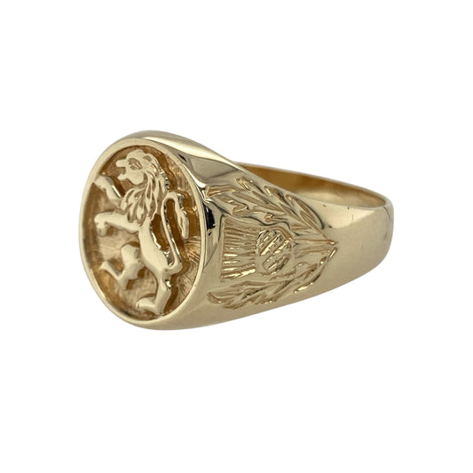Bring strength, heritage, and bold elegance to your collection with this pre-owned 9ct yellow gold oval lion signet ring—a striking design that combines traditional symbolism with refined craftsmanship.

Design: The ring features an engraved lion motif on the oval-shaped front, symbolising courage and nobility. The detailed thistle engravings on the shoulders add a touch of Scottish heritage and intricate charm. Measuring 15mm high at the front, the ring makes a powerful and distinguished statement.