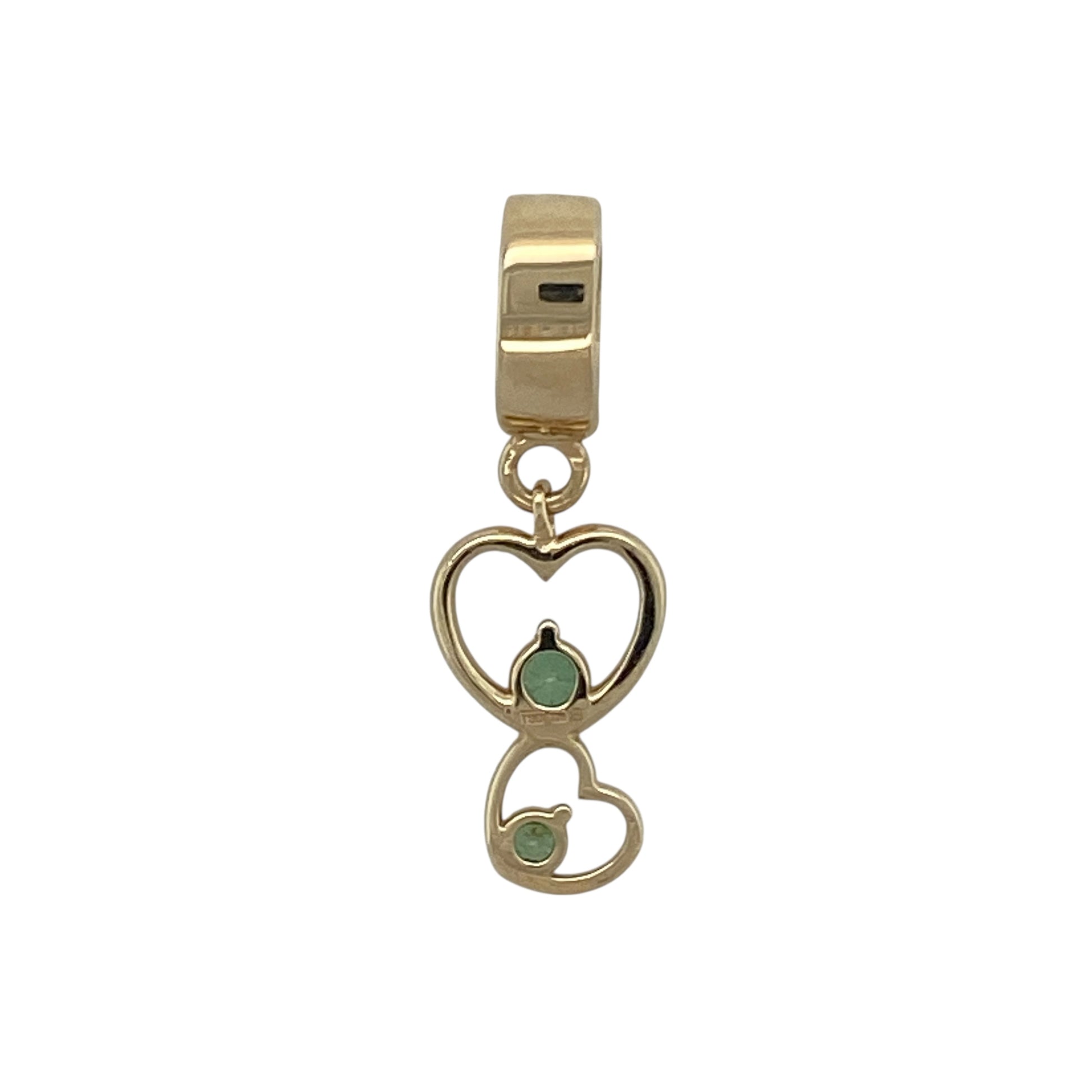 Bring romance, colour, and classic charm to your collection with this pre-owned 9ct yellow gold green stone double heart pendant—a beautifully symbolic piece representing love and connection.

Design: The pendant features two interlinked hearts, one adorned with a vibrant green stone that adds a touch of colour and elegance. The double heart design symbolises unity and affection, creating a timeless and meaningful look.