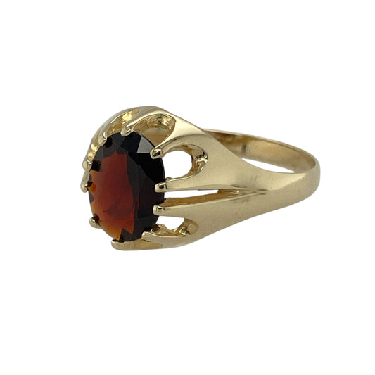 Bring timeless sophistication and rich colour to your collection with this pre-owned 9ct yellow gold and garnet signet ring, combining classic elegance with bold gemstone beauty—perfect for everyday luxury or special occasions.

Design: The ring showcases an oval-cut garnet measuring 9mm by 7mm, displaying deep red tones that reflect beautifully in the light.
Material: Made from 9-carat yellow gold, the polished finish enhances the warmth of the metal and complements the garnet’s striking colour.