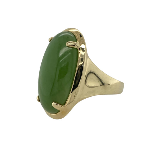 Bring serene beauty and timeless elegance to your collection with this pre-owned 9ct yellow gold and jade dress ring, combining refined design with natural gemstone charm—perfect for statement wear or sophisticated everyday style.

Design: The ring features an oval jade stone measuring 22mm by 11mm, displaying soft green tones and a smooth, polished finish that catches the light with subtle grace.