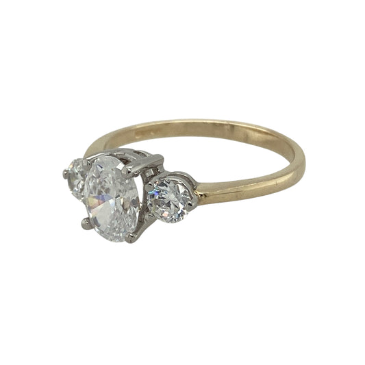 Bring classic sparkle and timeless elegance to your collection with this pre-owned 9ct yellow gold cubic zirconia trilogy ring, combining refined design with radiant brilliance—perfect for both everyday wear and special occasions.

Design: The ring features an oval-shaped centre cubic zirconia measuring 8mm by 6mm, flanked by two round cubic zirconias each measuring 4mm in diameter. The trilogy arrangement creates a balanced and sophisticated look that catches the light beautifully.
