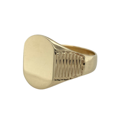 Bring bold elegance and timeless style to your collection with this pre-owned 9ct yellow gold plain face signet ring, combining classic design with subtle detailing—perfect for statement wear or everyday sophistication.

Design: The ring features a plain oval face measuring 16mm high, complemented by textured patterned shoulders that add depth and character to the design.