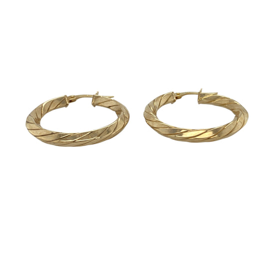 Bring classic elegance and radiant style to your collection with these pre-owned 9ct yellow gold twisted hoop creole earrings, combining timeless design with a touch of modern sophistication—perfect for everyday wear or special occasions.

Design: The earrings feature a graceful twisted hoop creole style that reflects the light beautifully, adding texture and depth to a traditional look.