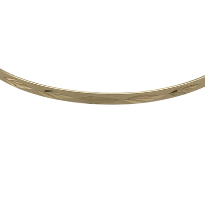 Bring timeless elegance and refined detail to your collection with this pre-owned 9ct yellow solid gold patterned bangle, combining classic sophistication with subtle texture—perfect for everyday wear or special occasions.

Design: The bangle features a delicate 2mm width with a finely patterned finish that adds understated sparkle and dimension to its sleek profile.