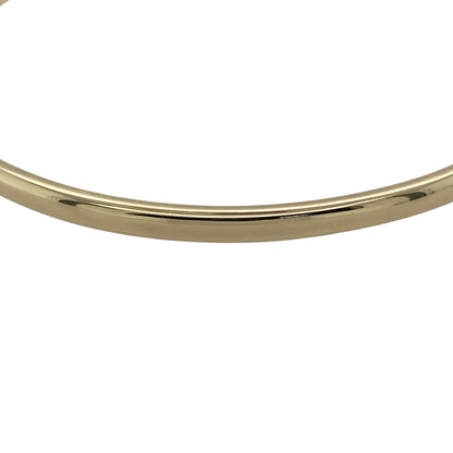 Bring classic sophistication and timeless simplicity to your collection with this pre-owned 9ct yellow solid gold plain bangle, combining enduring style with a polished finish—perfect for both everyday wear and elegant occasions.

Design: The bangle features a smooth, plain design with a 3mm width, offering a sleek and refined look that pairs beautifully with other pieces or stands out on its own.