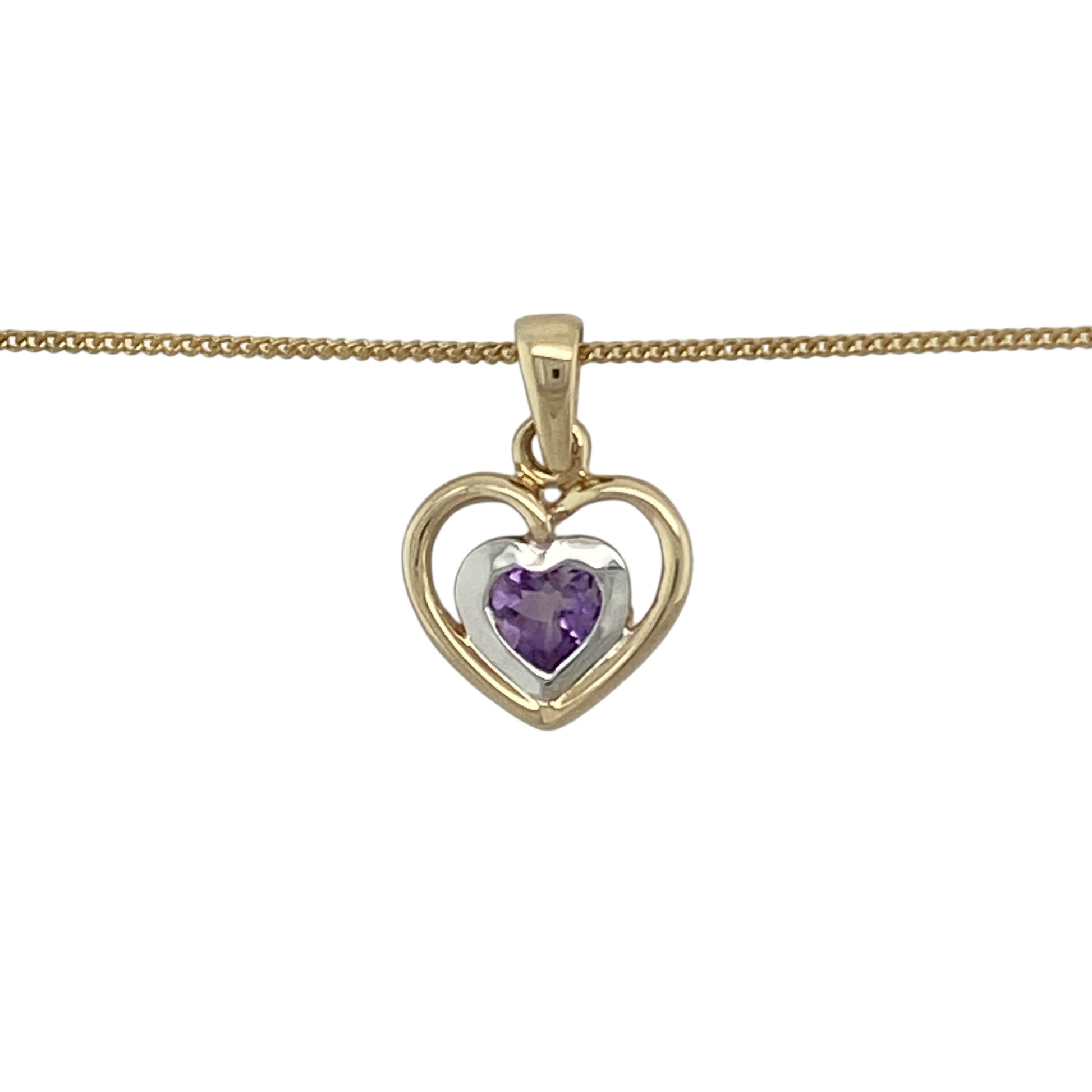 Bring romantic charm and soft colour to your collection with this pre-owned 9ct yellow and white gold amethyst heart pendant necklace, combining elegant design with timeless sentiment—perfect for both everyday wear and special occasions.

Design: The pendant features a delicate heart design adorned with a beautiful amethyst stone, radiating soft purple tones. Measuring 1.6cm long including the bail, it hangs gracefully from an 18-inch fine curb chain for a refined, feminine look.