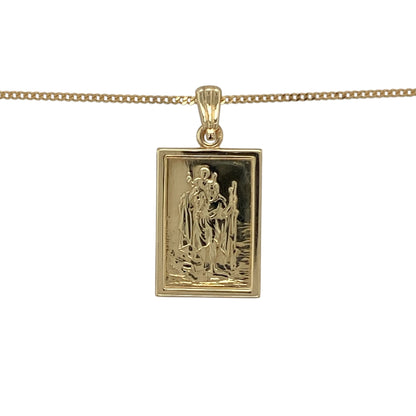 Bring meaningful style and classic faith-inspired design to your collection with this pre-owned 9ct yellow gold St Christopher pendant necklace, combining traditional craftsmanship with timeless elegance—perfect for everyday wear or as a thoughtful gift.

Design: The pendant features a rectangular St Christopher design, symbolising protection and safe travels, and measures 2.5cm long including the bail. It is paired with an 18-inch curb chain, creating a refined and balanced look.