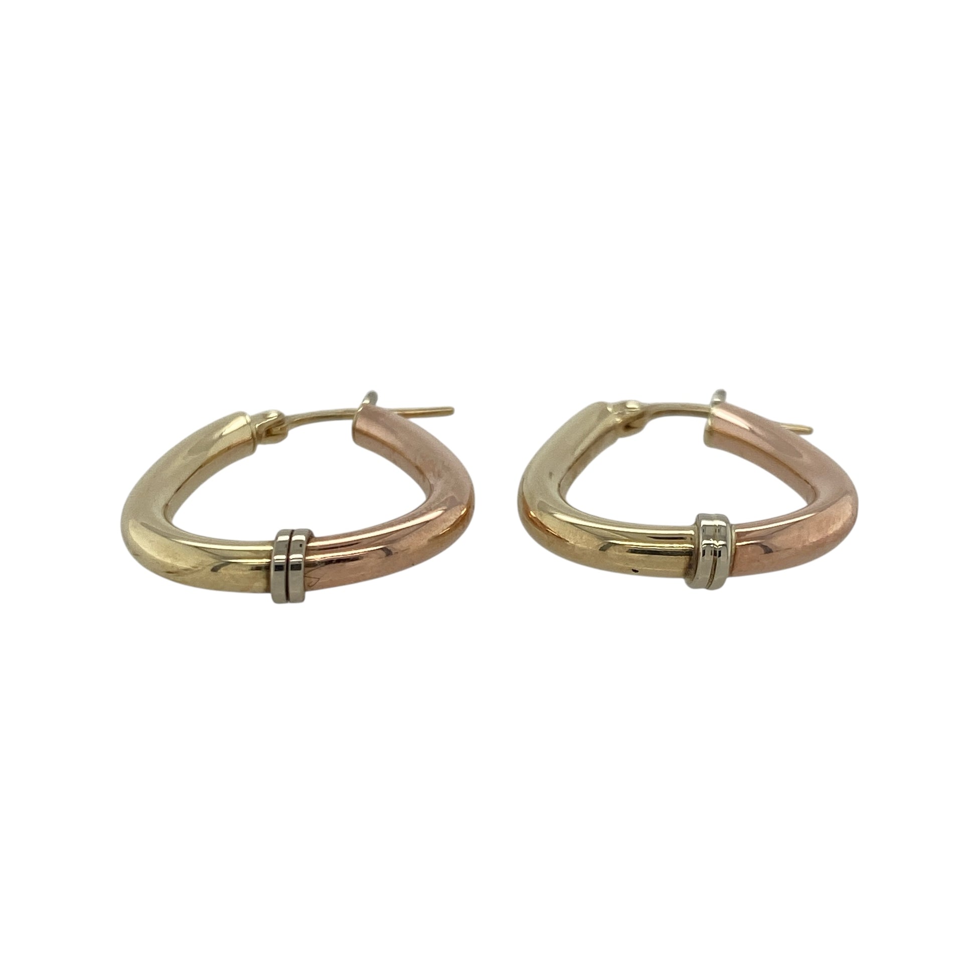 Bring elegant contrast and timeless sophistication to your collection with these pre-owned 9ct yellow, rose, and white gold oval creole earrings, combining classic style with a modern tri-colour twist—perfect for any occasion.

Design: Each earring features an oval creole shape crafted from interwoven bands of yellow, rose, and white gold, creating a harmonious blend of warm and cool tones with a refined finish.