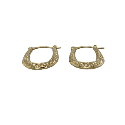 Bring subtle elegance and classic charm to your collection with these pre-owned 9ct yellow gold patterned oval creole earrings, combining timeless design with delicate detail—perfect for everyday wear or refined occasions.

Design: Each earring features an oval creole shape adorned with a fine patterned finish, adding texture and a touch of sophistication to this traditional style.