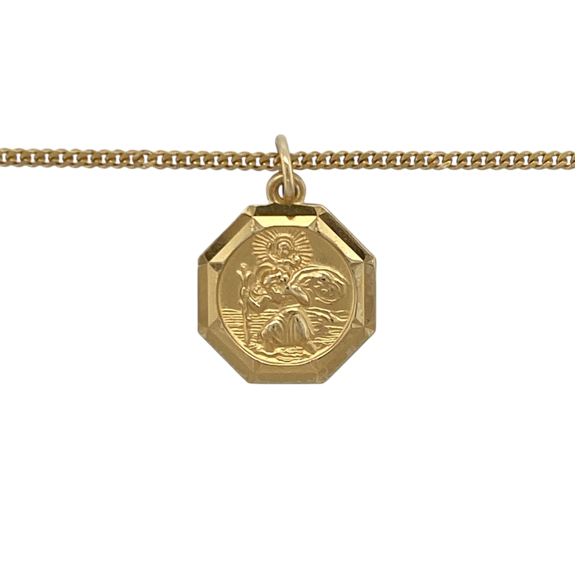Bring classic faith and timeless style to your collection with this pre-owned 9ct yellow gold octagon-shaped St Christopher pendant on an 18" curb chain necklace, symbolising protection and safe travels—perfect for everyday wear or as a meaningful gift.

Design: The pendant features an octagon shape with a detailed depiction of St Christopher, measuring 1.9cm long including the bail, and is suspended from an 18" curb chain for a polished, elegant look.