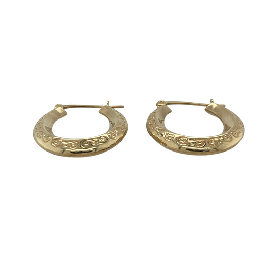 Bring timeless style and subtle texture to your look with these pre-owned 9ct yellow gold patterned oval creole earrings—perfect for everyday wear or adding a touch of elegance to any occasion.

Design: Each earring features an elegant oval creole shape with a detailed patterned finish, adding depth and sophistication to this classic design. The polished edges enhance the overall shine and create a beautifully balanced look.