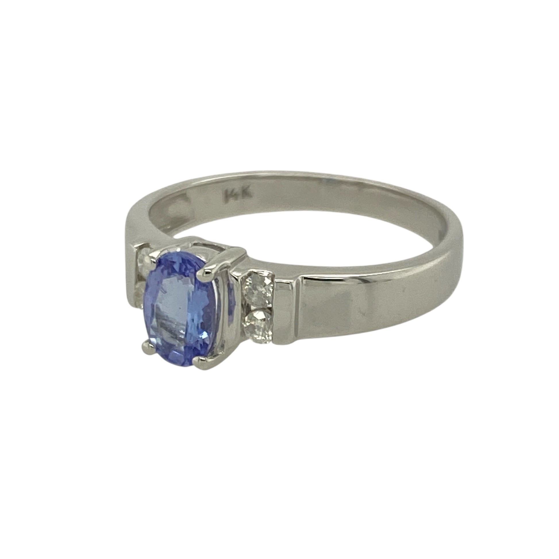 Bring elegant colour and refined sparkle to your collection with this pre-owned 14ct white gold diamond and tanzanite set ring—perfect for adding a touch of sophistication and luxury to any occasion.

Design: The ring features a captivating 6mm by 4mm oval-cut tanzanite at its centre, displaying the stone’s signature violet-blue hues. Two brilliant-cut diamonds are set on each side, enhancing the tanzanite’s colour and creating a graceful, balanced design.