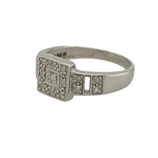 Bring elegant sparkle and modern design to your collection with this pre-owned 9ct white gold diamond set square cluster ring—perfect for adding timeless sophistication to any occasion.

Design: The ring features a 7mm-high square cluster of dazzling diamonds, creating a striking focal point with a brilliant, symmetrical finish. The shoulders are also set with diamonds, adding extra sparkle and enhancing the overall radiance of the piece.
Material: Made from 9-carat white gold