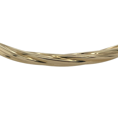 Bring classic elegance and subtle texture to your collection with this pre-owned 9ct yellow gold twisted bangle—perfect for adding timeless sophistication to any look.

Design: The bangle features a 4mm-wide band with a graceful twisted design, creating a beautiful interplay of light and texture for a refined and stylish finish.
Material: Made from 9-carat yellow gold, the warm tone enhances the twisted pattern and provides lasting shine and durability.