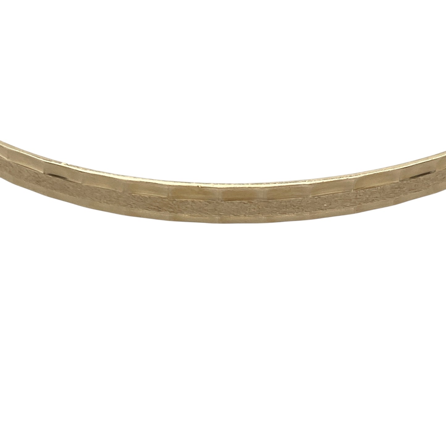 Bring understated elegance and subtle texture to your collection with this pre-owned 9ct yellow solid gold patterned bangle — a refined accessory that adds a touch of sophistication to any look.

Design: The bangle features a delicately patterned finish along its surface, offering a beautiful play of light and a timeless decorative appeal.
Material: Made from solid 9-carat yellow gold, the warm tone enhances the intricate detailing and gives the piece a luxurious yet versatile charm.