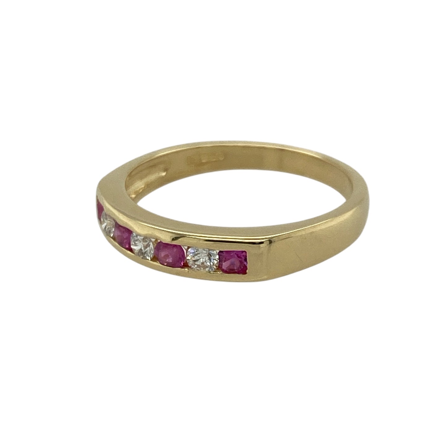 Add timeless beauty and refined colour to your collection with this pre-owned 18ct yellow gold diamond and ruby set band ring — a classic design that radiates warmth, elegance, and sophistication.

Design: The ring features a row of alternating round-cut 2mm rubies and sparkling diamonds across the 4mm wide front of the band, creating a balanced and graceful display of colour and brilliance.