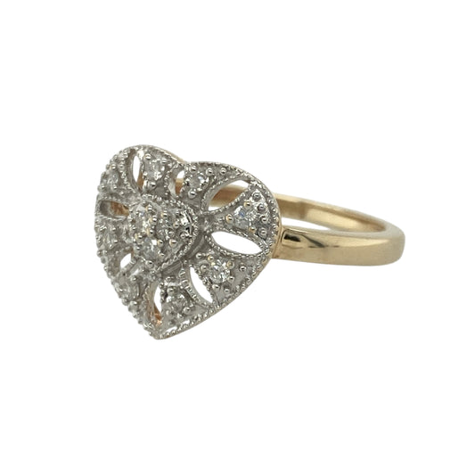 Add romantic charm and elegant detail to your collection with this pre-owned 9ct yellow and white gold diamond set open filigree heart ring — a beautifully feminine piece with timeless appeal.

Design: The ring features an intricate open filigree heart design at the front, measuring 13mm high, adorned with delicate diamonds that add subtle sparkle and depth to the graceful pattern.