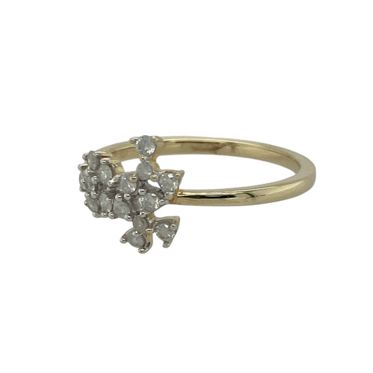 Add delicate sparkle and timeless charm to your collection with this pre-owned 9ct yellow gold diamond set flower cluster ring — a beautifully feminine design that radiates classic elegance.

Design: The ring features fifteen small round diamonds arranged in a graceful flower cluster pattern across the front of the band. The design extends in a line up to 10mm wide, creating a refined and eye-catching display of light and brilliance.