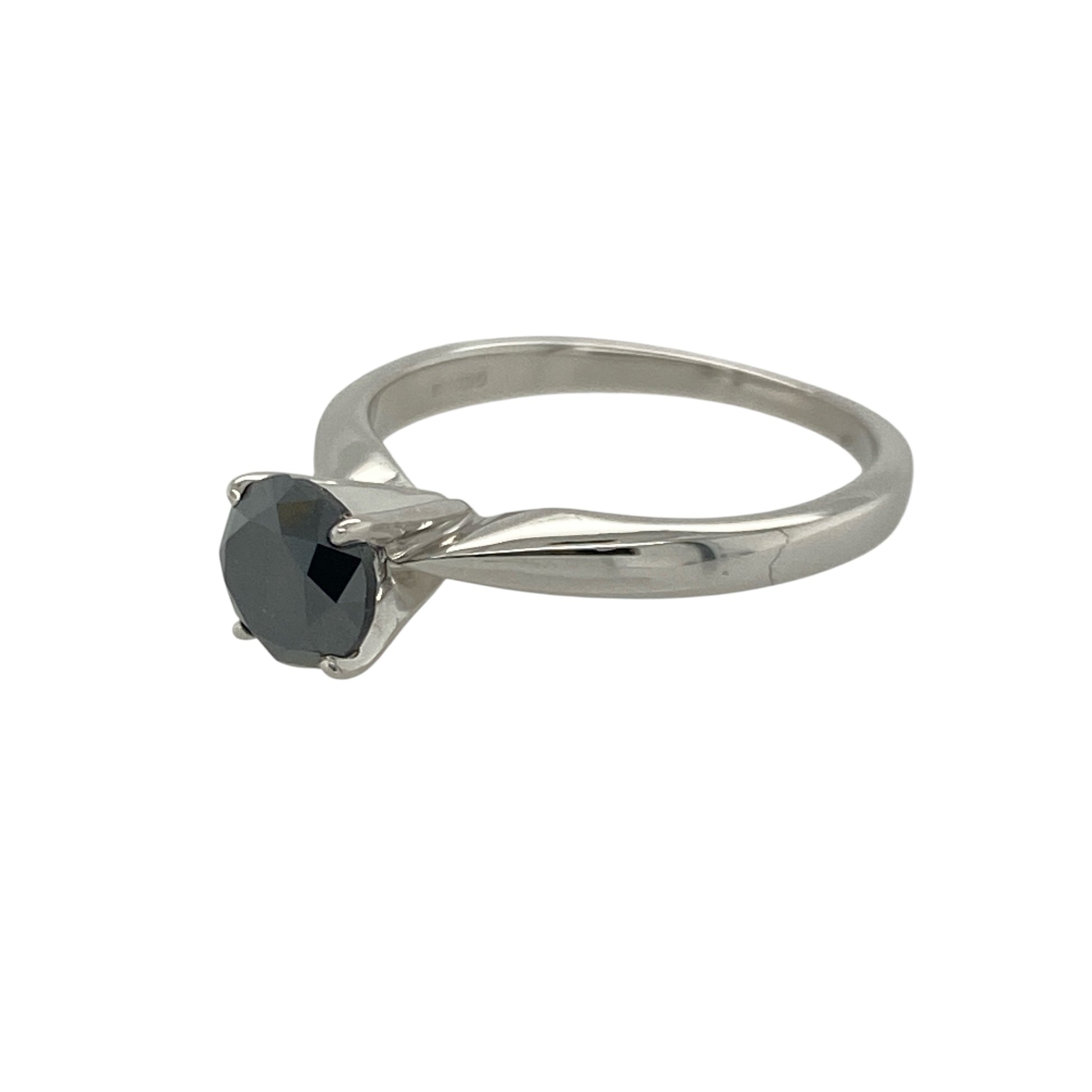 Add bold sophistication and contemporary elegance to your collection with this pre-owned 18ct white gold black diamond set solitaire ring — a striking piece that combines modern style with timeless allure.

Design: The ring features a brilliant-cut black diamond of approximately 0.76 carats, creating a captivating centrepiece with a rich, mysterious sparkle and sleek minimalist setting.